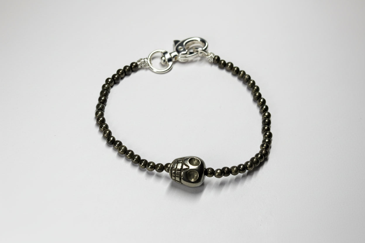 Bracelet with skull charm and beaded chain