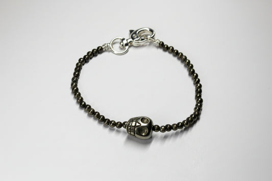Bracelet with skull charm and beaded chain
